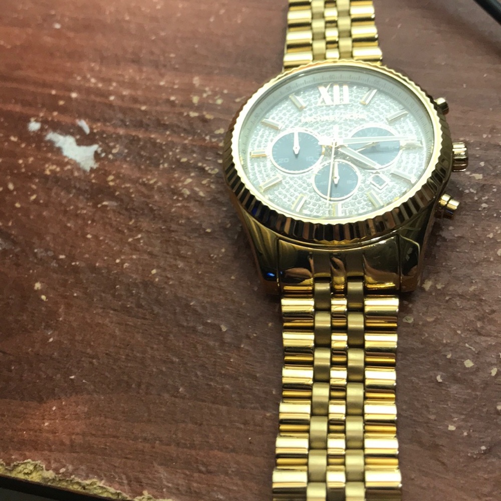 Men’s gold Michael Kors watch
